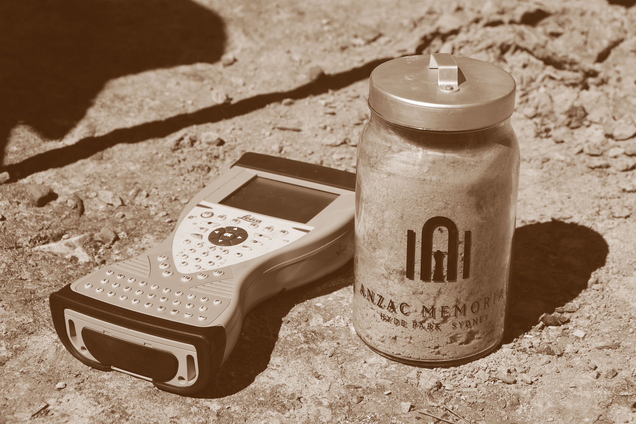 Image features a jar of soil from Blayney and one of Spatial Services' hand held GPS units