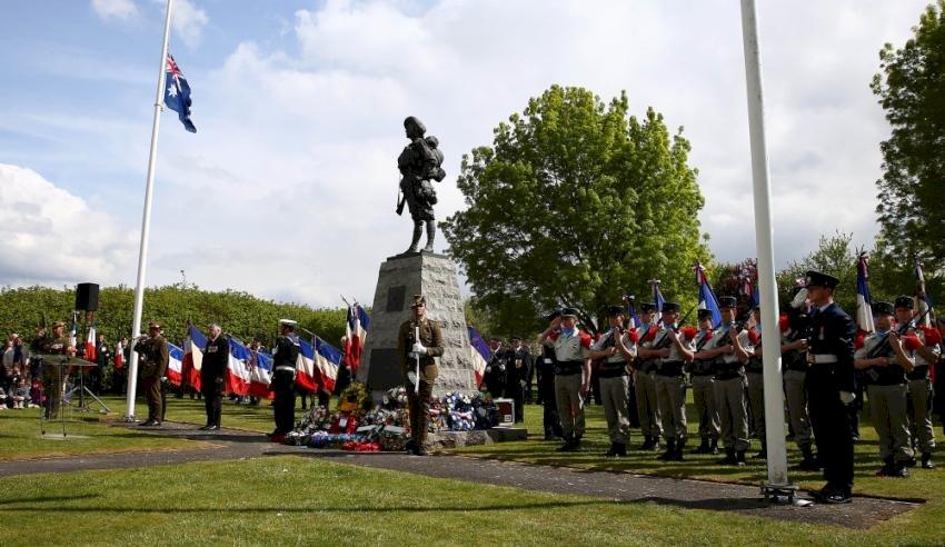 French and ADF personnel participating in the Anzac Day service at Bullecourt on 25 April 2017.  The Bullecourt Digger statue is located at the top end of the battlefield close to the old German front line. Courtesy Australian Department of Defence