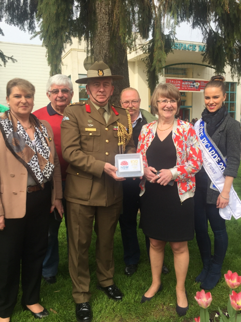 Madame Therese Dheygers, Mayor of Peronne; Colonel S E Clingan, Defence Attache Commemorations, and local dignitaries, pose with a soil sample collected from the Historial de la Grande Guerre (Museum of the Great War) in Peronne, France.