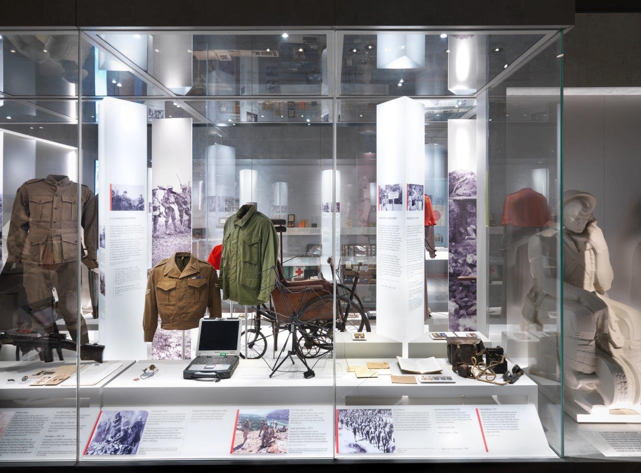 Eddie Wright's jackets (centre) on display at the Memorial's Centenary Exhibition