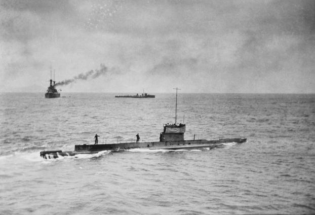 One of the last known photographs of Australian submarine HMAS AE1 off Rabaul, taken just before she disappeared on 14 September 1914.  In the background are the flagship HMAS Australia (left) and the destroyer HMAS Yarra. Image courtesy Navy.gov.au