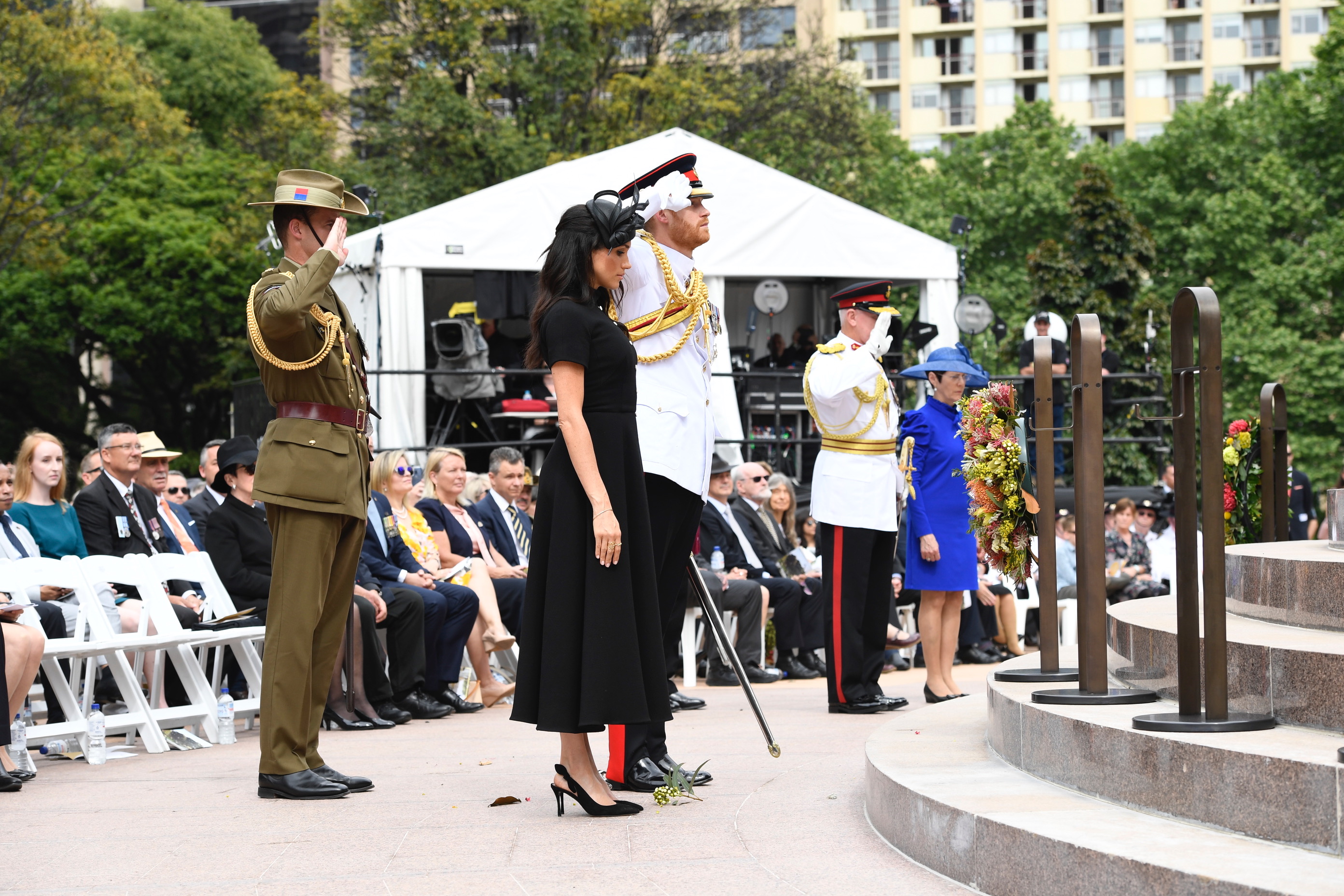 The Duke and Governor salute after laying their wreaths