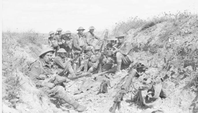 Men of the 24th Battalion, 6th Infantry Brigade waiting for an artillery barrage to cease on Mont St Quentin before resuming the assault, 1 September 1918.  Courtesy AWM