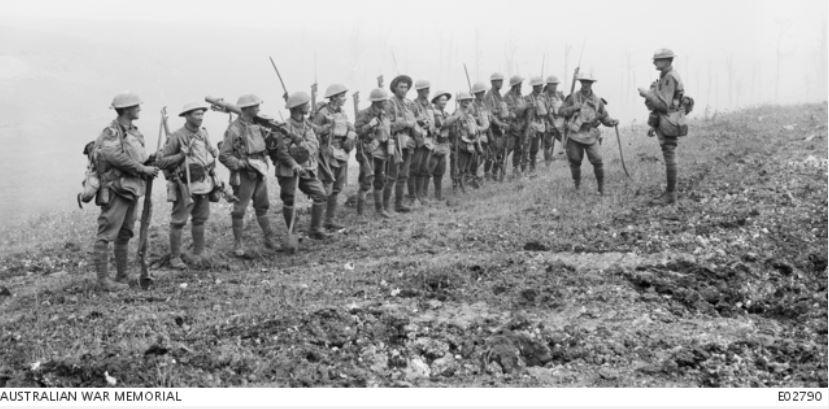 Lt RFA Downes, MC giving orders to his platoon from the 29th Infantry Battalion before advancing towards Harbonnières, their second objective during the Battle of Amiens on 8 August 1918. Courtesy AWM