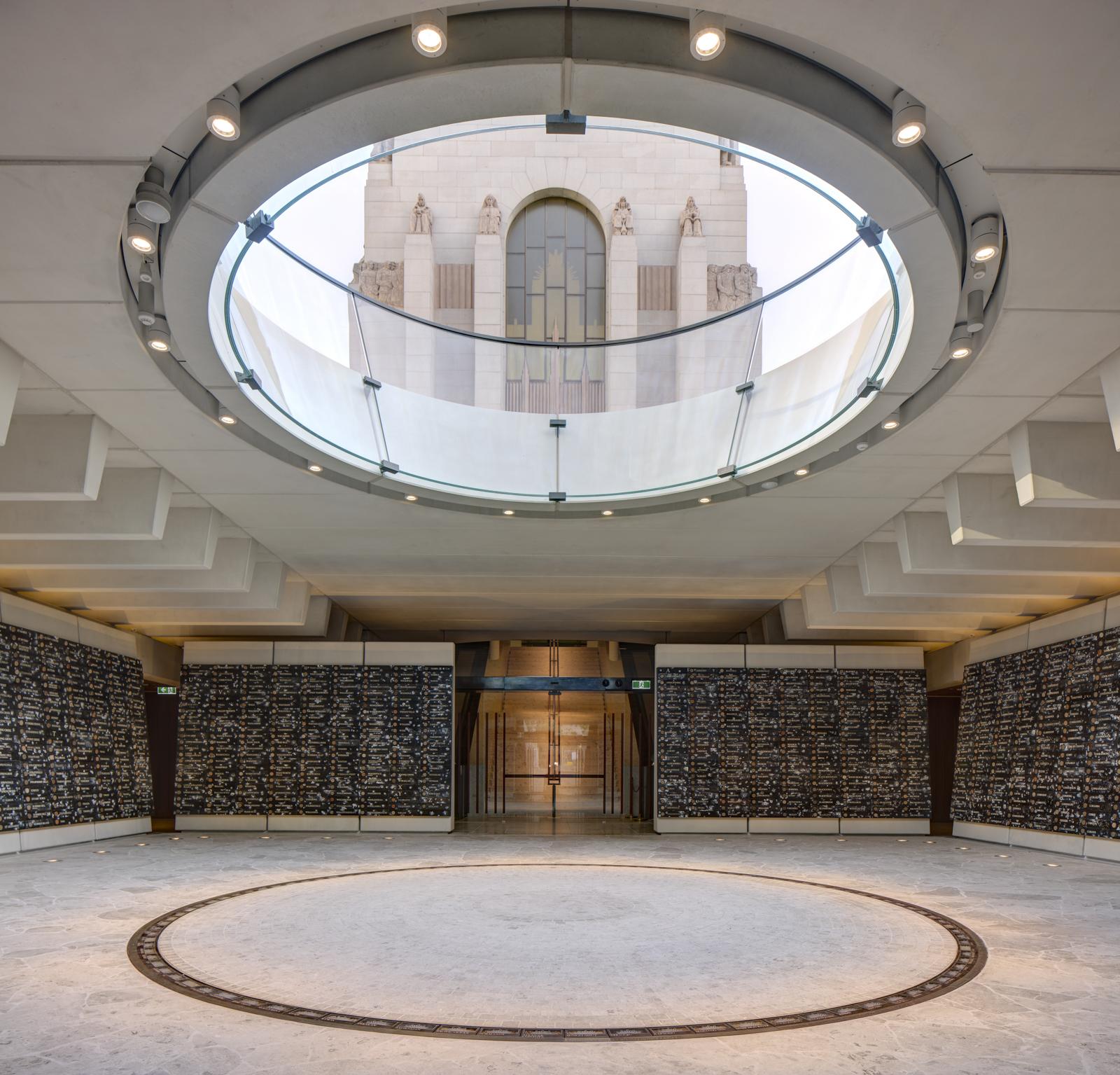 The original Memorial building can be seen through the open occulus of the Hall of Service. Directly below the occulus is a ring of brass plaques detailing sites of significance to NSW's miltary history.