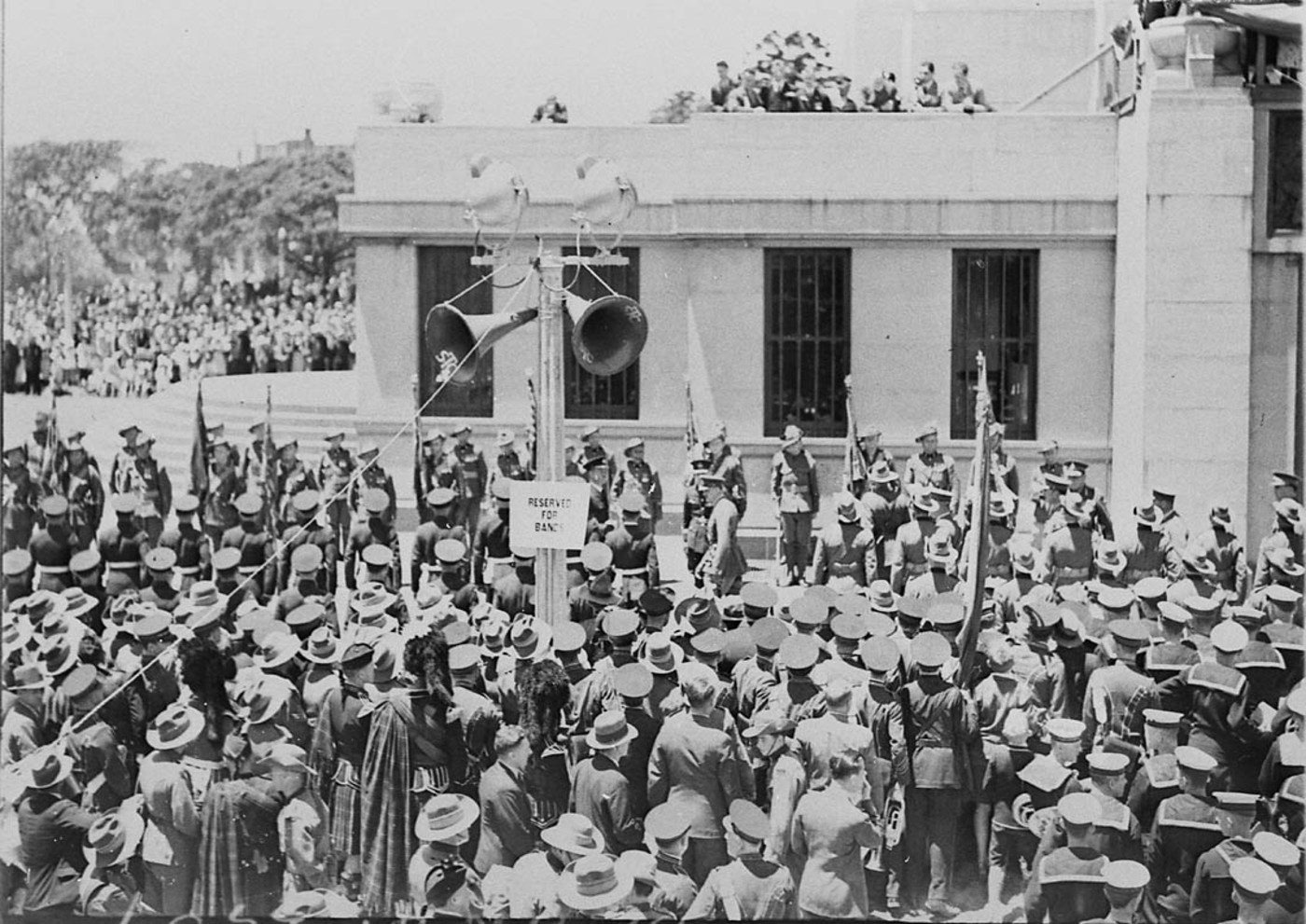 The band stands at attention on the north western corner near the Memorial 