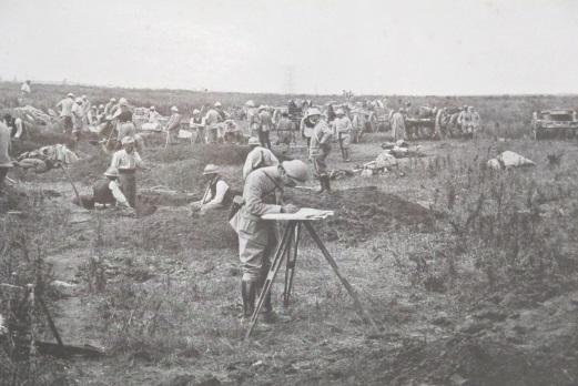 A French soldier using a plain table to survey an artillery battery position, c1917