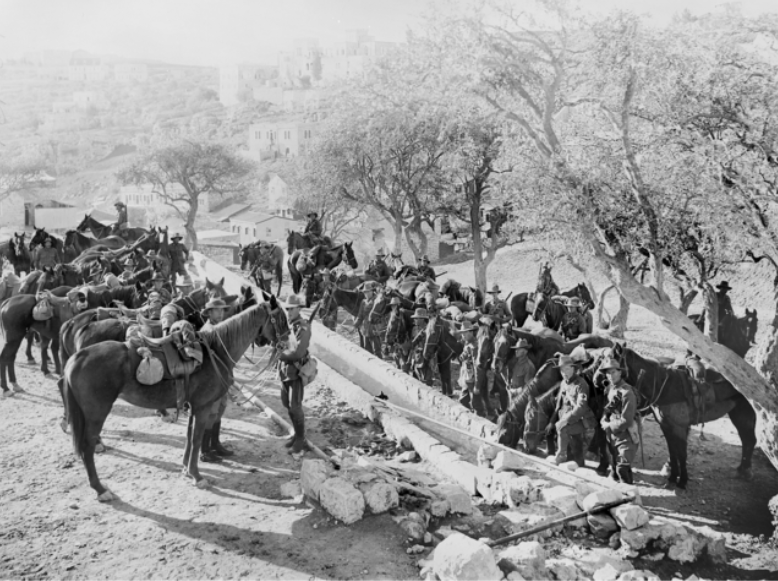 Australians of the Anzac Mounted Division watering their horses at the foot of Mount Zion, Palestine, January 1918. AWM B01518