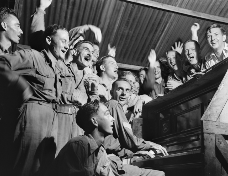 The men of No. 81 Wing, RAAF, celebrate the news of their imminent victory over Japan, Labuan Island, North Borneo, 11 August 1945. AWM OG3151. 