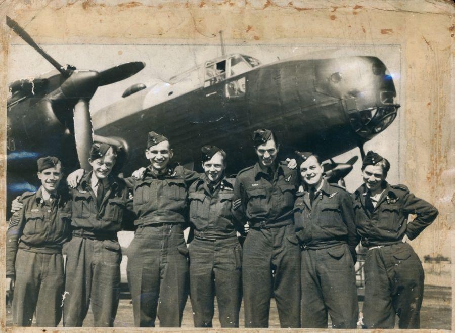 Pilot Officer Frank Mathers CGM and his fellow crew members in front of their four-engined Halifax that was part of the RAF Bomber Command.