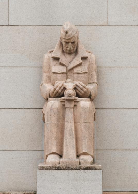 Photograph of the Air Force Mechanic buttress sculpture on the Memorial's facade