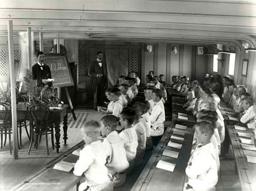Boy sailors receive a lesson in the school room of NSS 'Sobraon', c. 1895. Courtesy of NSW State Archives. 