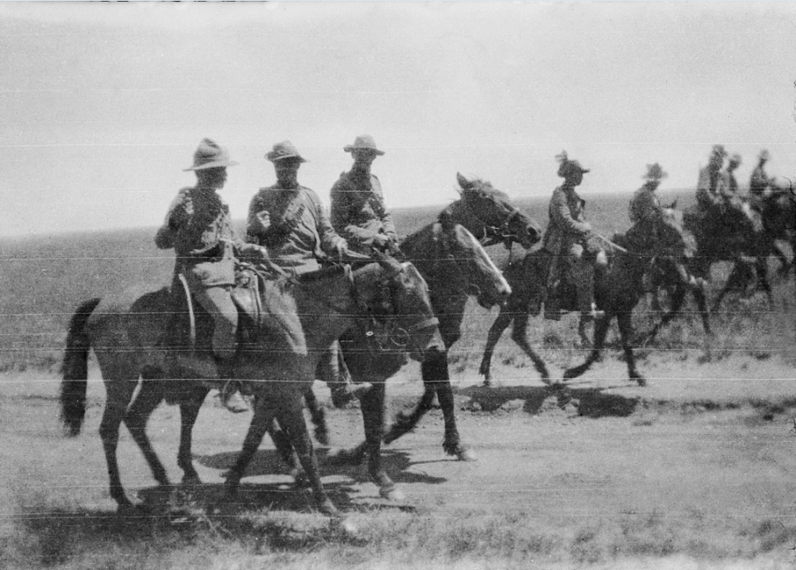 Mounted on horseback, six Australian soldiers, presumably Tasmanians, wear slouch hats, South Africa, c. 1900. (AWM P00175.058)