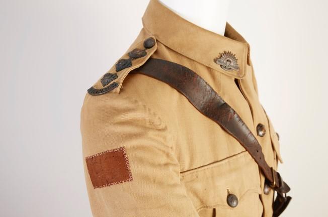 Australian Army Medical Corps (AAMC) uniform and a leather saddle with girth strap related to Captain George Redfearn Hamilton.