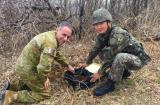Major Simon Hawkins collecting soil with Korean military personnel in Maryang San, Korean DMZ.