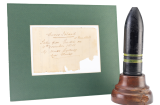 Despite the horrific scenes that faced them, many of HMAS 'Sydney'’s boarding party souvenired objects from the 'Emden'. This shell was one such souvenir. Along with a note from Glossop confirming its authenticity, the mounted shell was donated to the Anzac Memorial by Kerrie Jeffriess in 2018. Anzac Memorial Collection 2018.18.