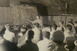 A Major of the Japanese army helps to educate the RAAF’s BCOF volunteers on the trickier points of Japanese phonetics, Labuan Island, North Borneo, 3 November 1945. AWM OG3633.